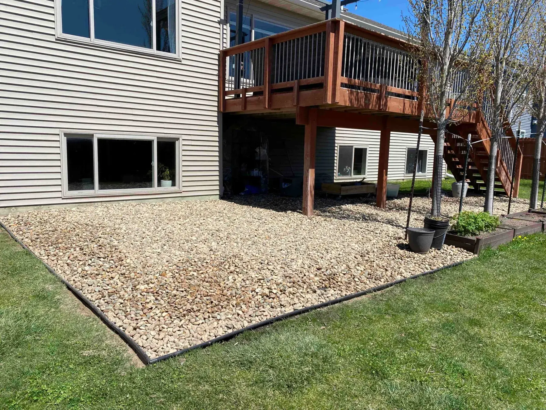 Backyard rock landscaping completed by Minnlawn