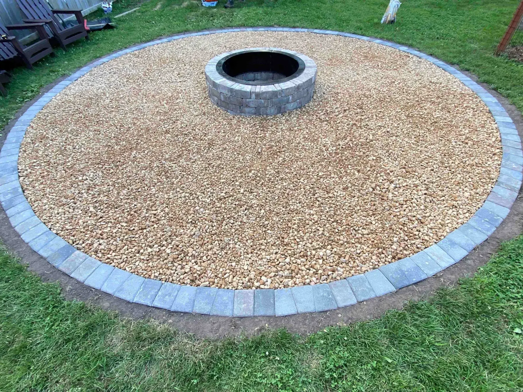Backyard before Minnlawn fire pit landscaping project