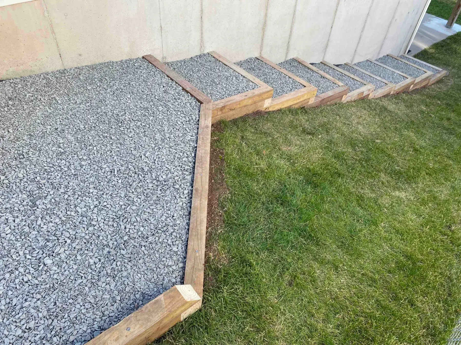 Gravel landscaping and outdoor steps completed by Minnlawn